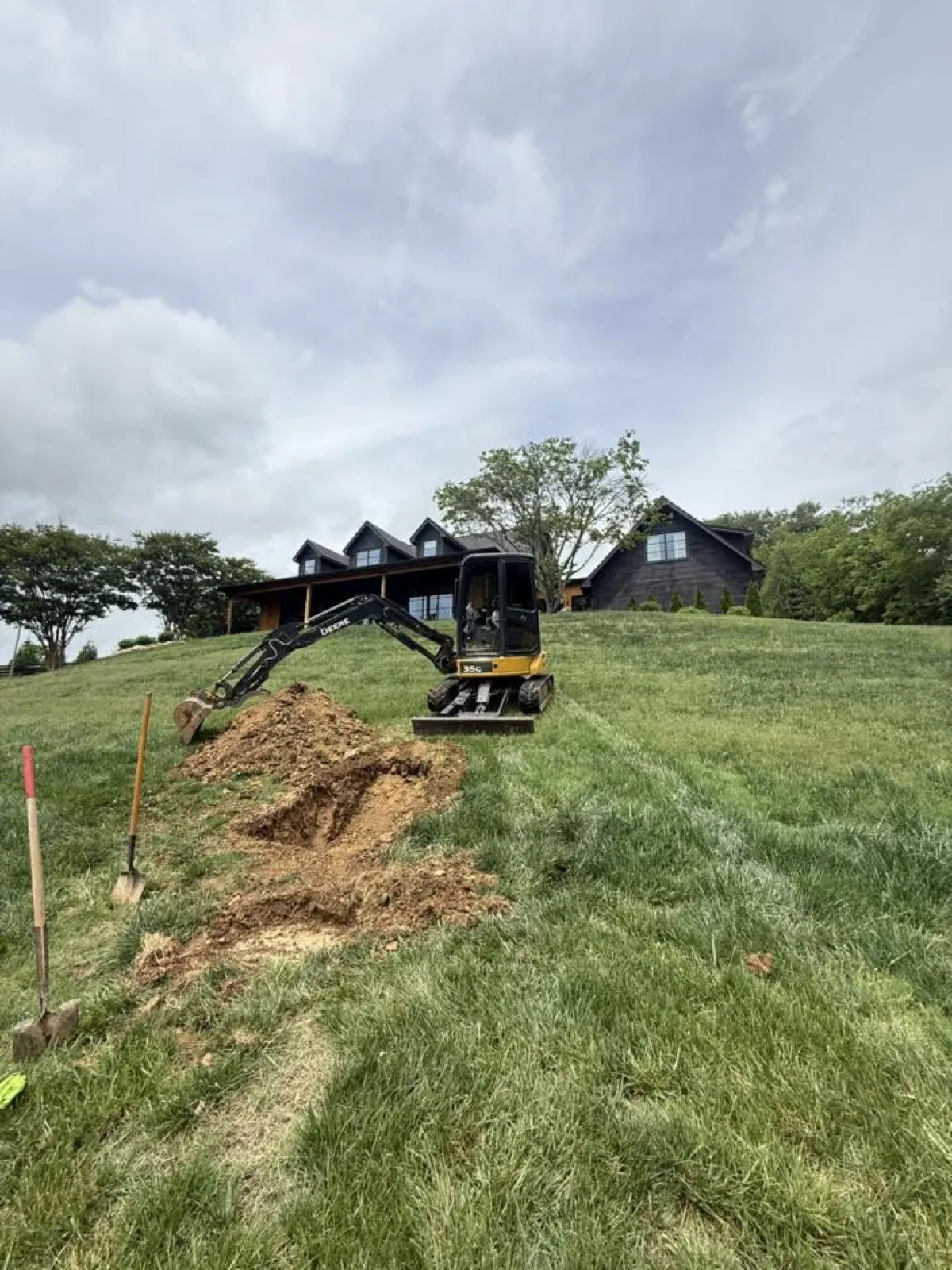 Excavator working a septic installation site