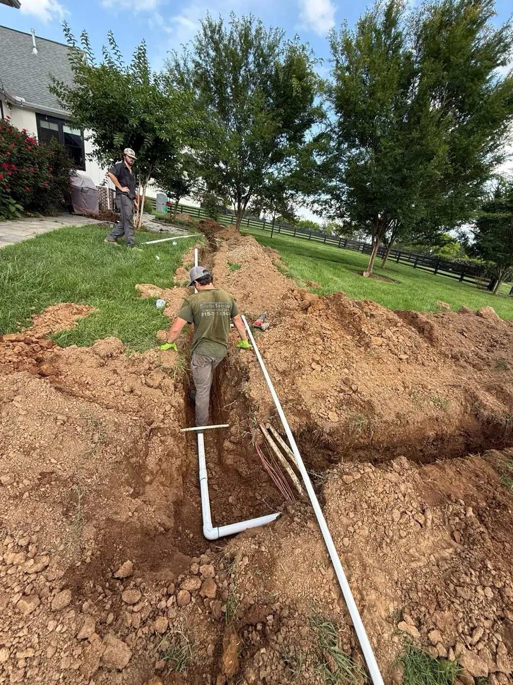 Field line pipe run down a fresh trench
